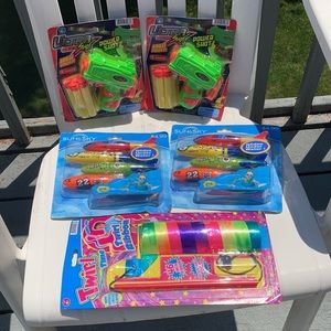 NWT 2 dive rockets, 2,foam shot darts and a Ribbon Game